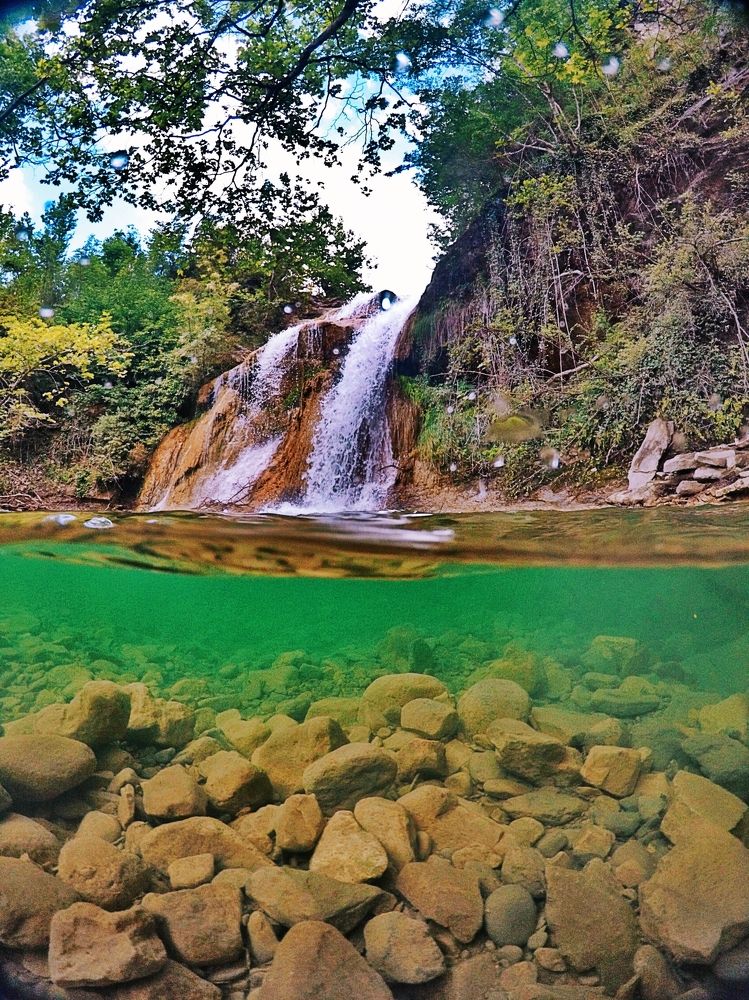 Under the waterfall
