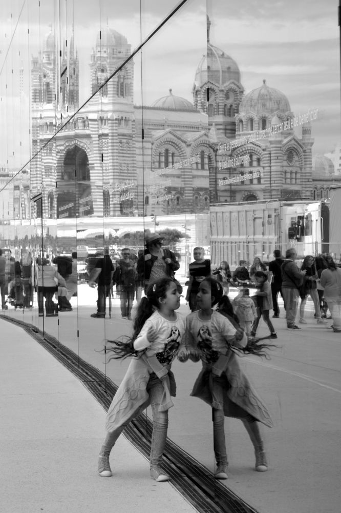 The reflect of the little girl.