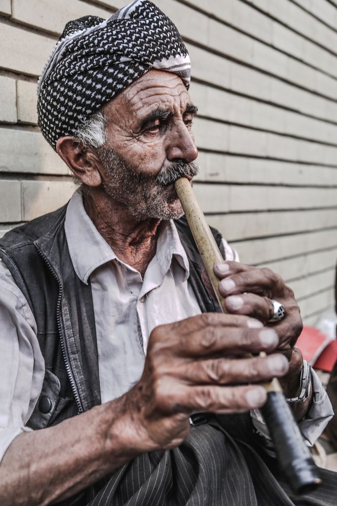 man playing flute