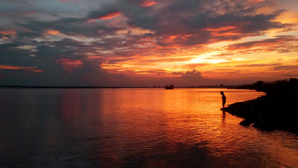 Little boy at the river bank