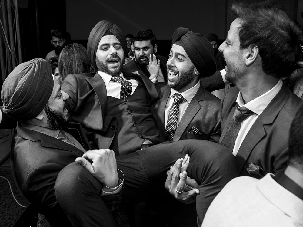 Friends are having fun with the groom.