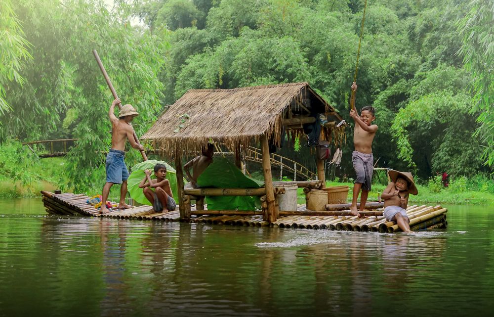 happy child fishing at beautiful lake