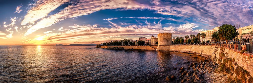 Embankment of Alghero, Italy at sunset.