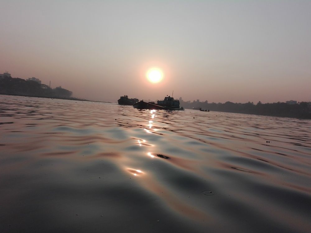 Sun Rises Over River