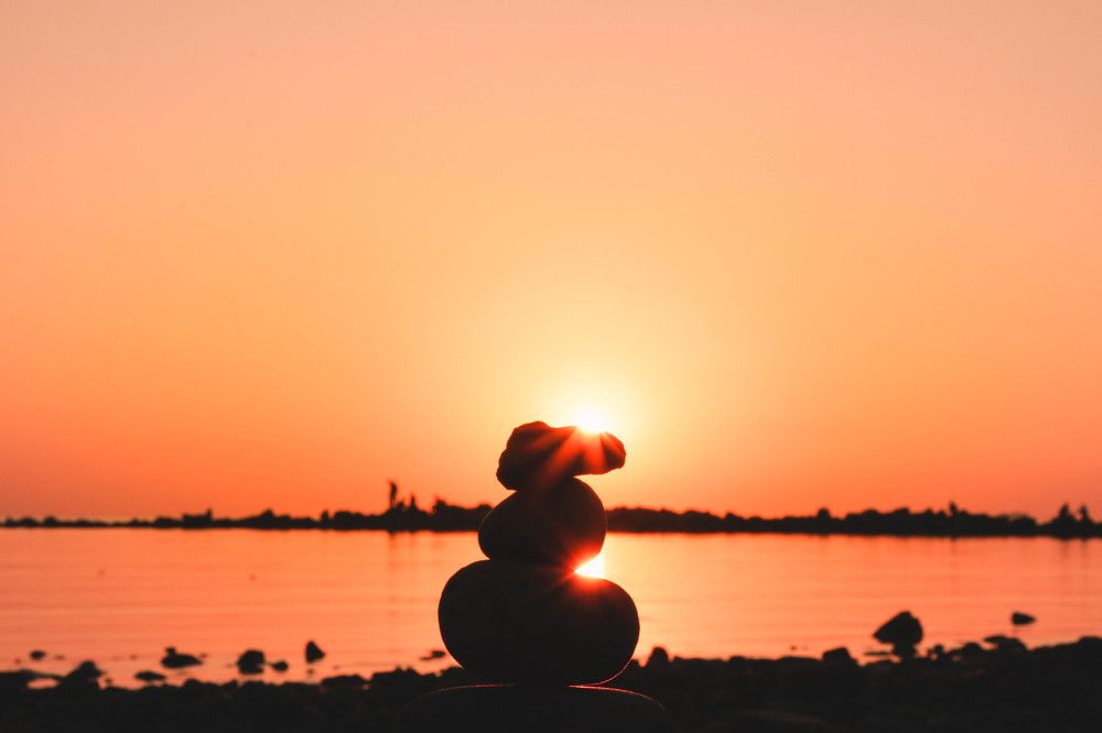 Sunset behind a rock