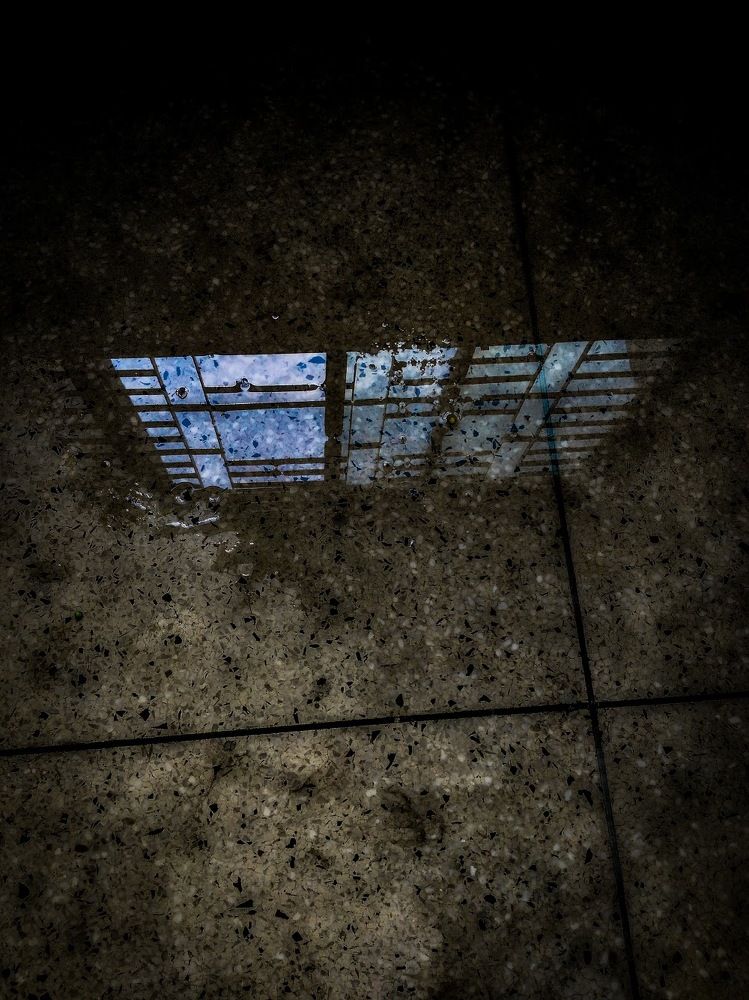 Reflection of sky through the window in water