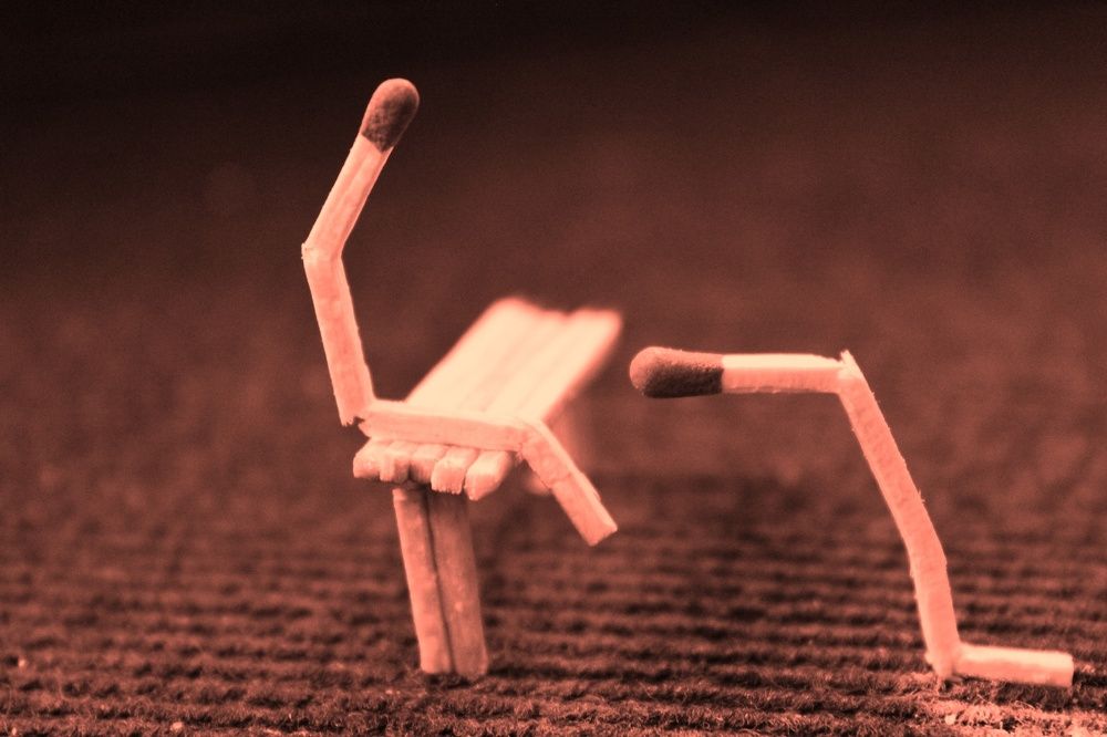 a girl is setting on the table and boy saying please forgive me !!!