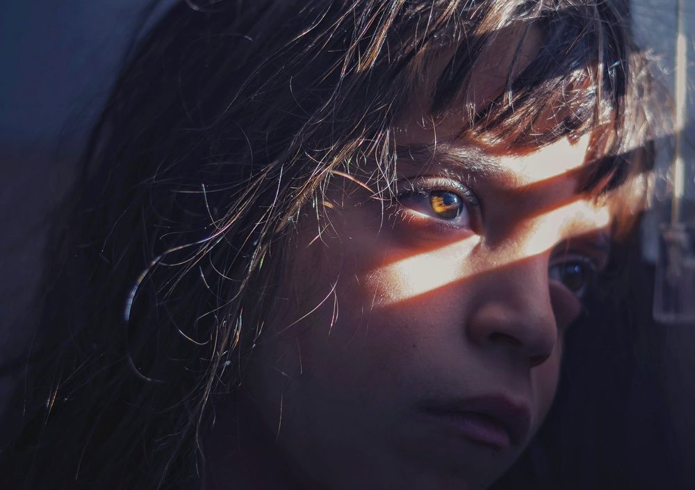 Ray of light on the girl's face