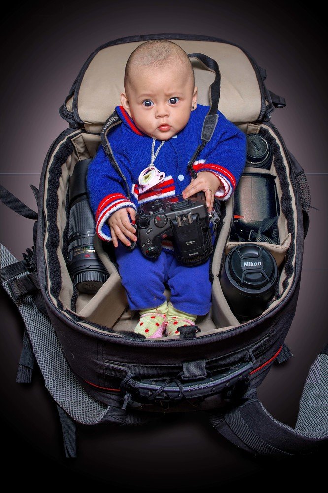 Baby in camera bag