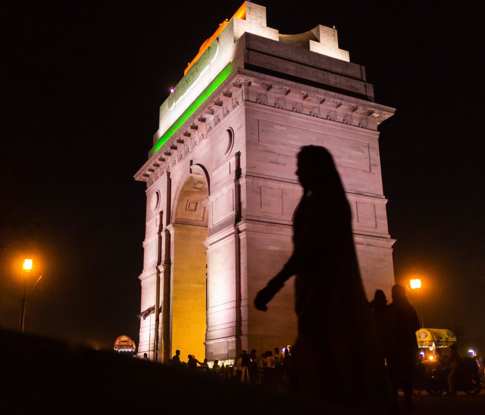 Unique combination of Indian flag tri-colors, India gate and a shadow of a woman