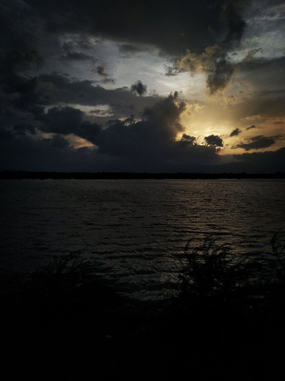 Between the clouds.