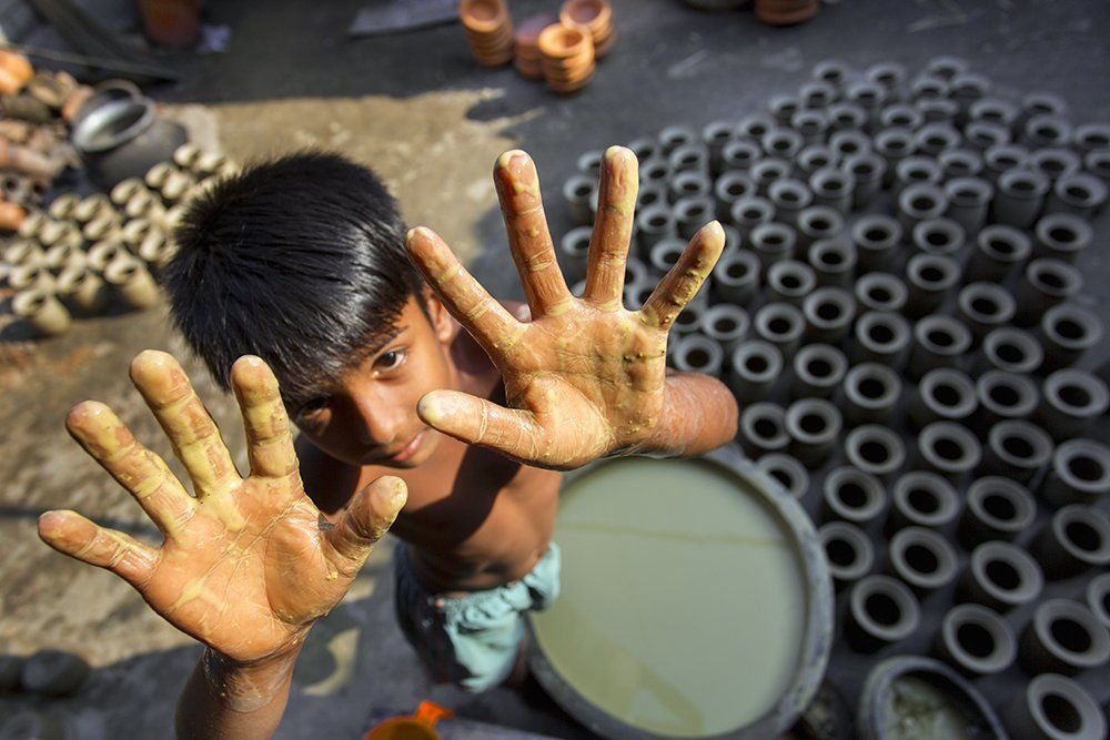 Portrait of a kid potter.
