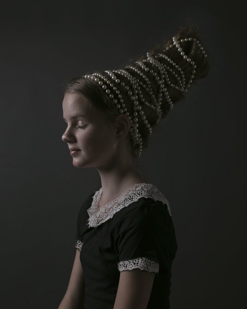 The gril with the pearl hairdo