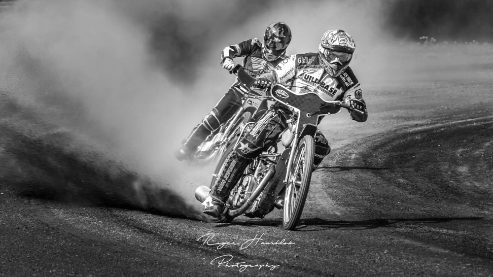 Concentration on the face of the speedway rider.