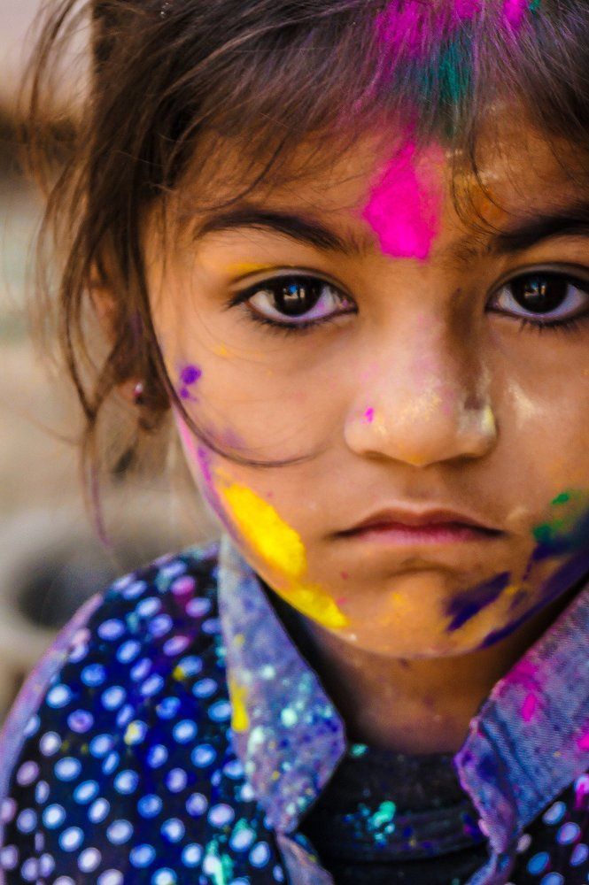 Holi colours with angry child