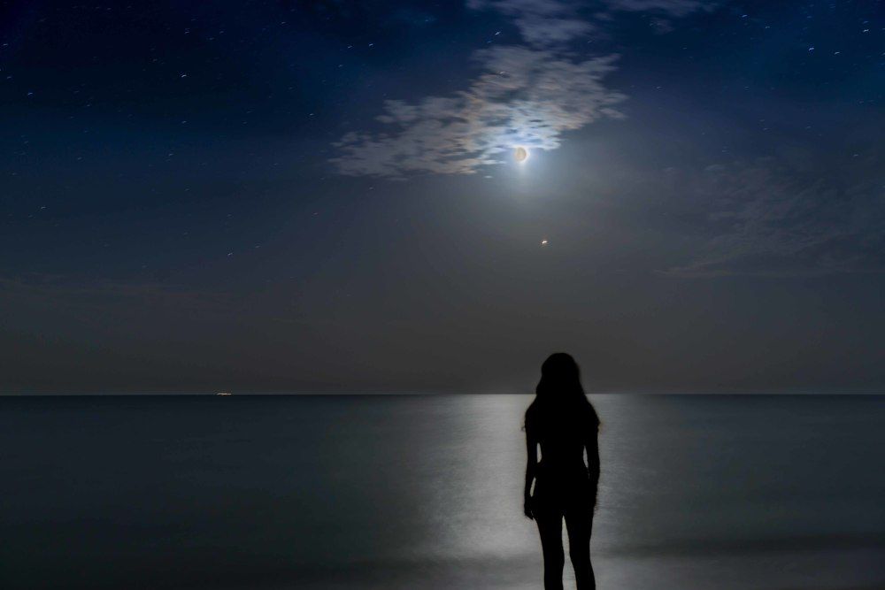 A girl watches a lunar eclipse