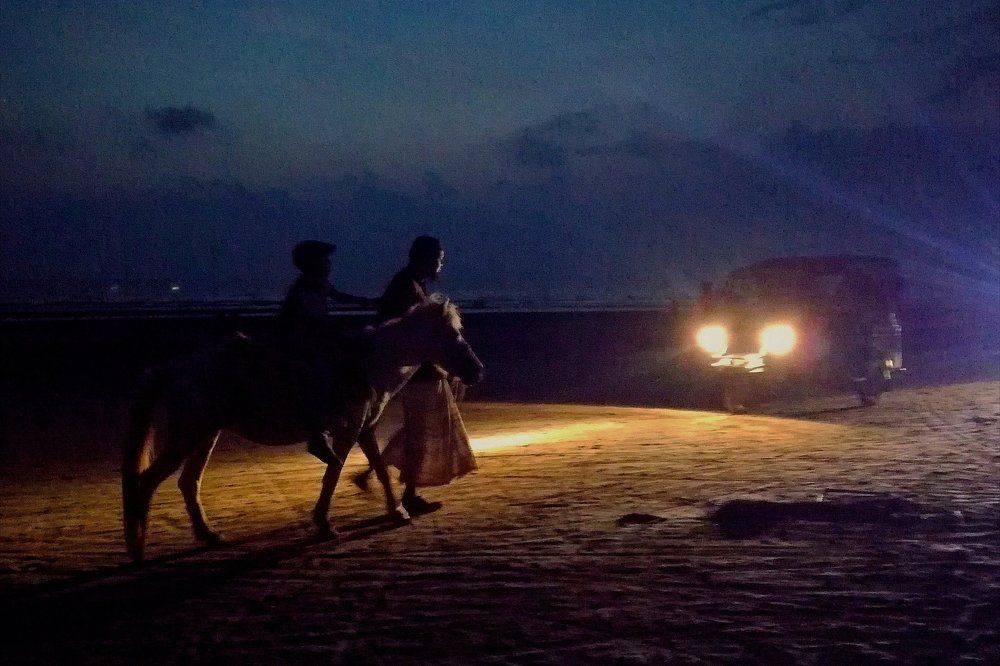 Riders on sea shore...