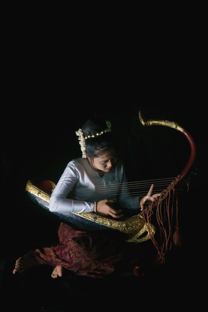 A Girl Playing Burmese Traditional Harp