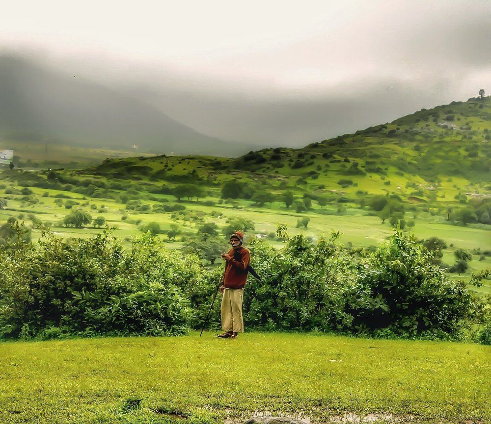 Man enjoying his smoking time in cloudy weather .