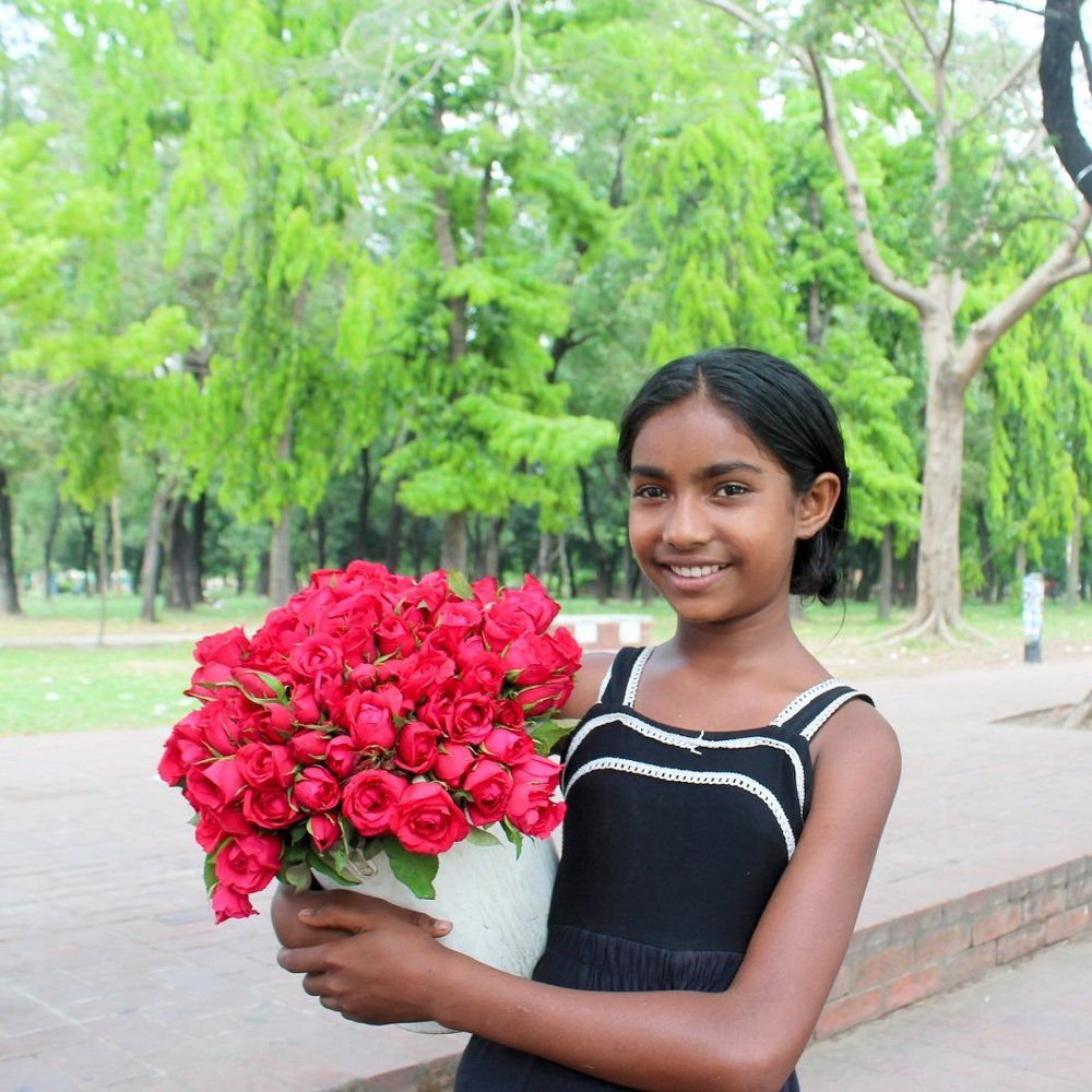 Smile of street rose seller girl.