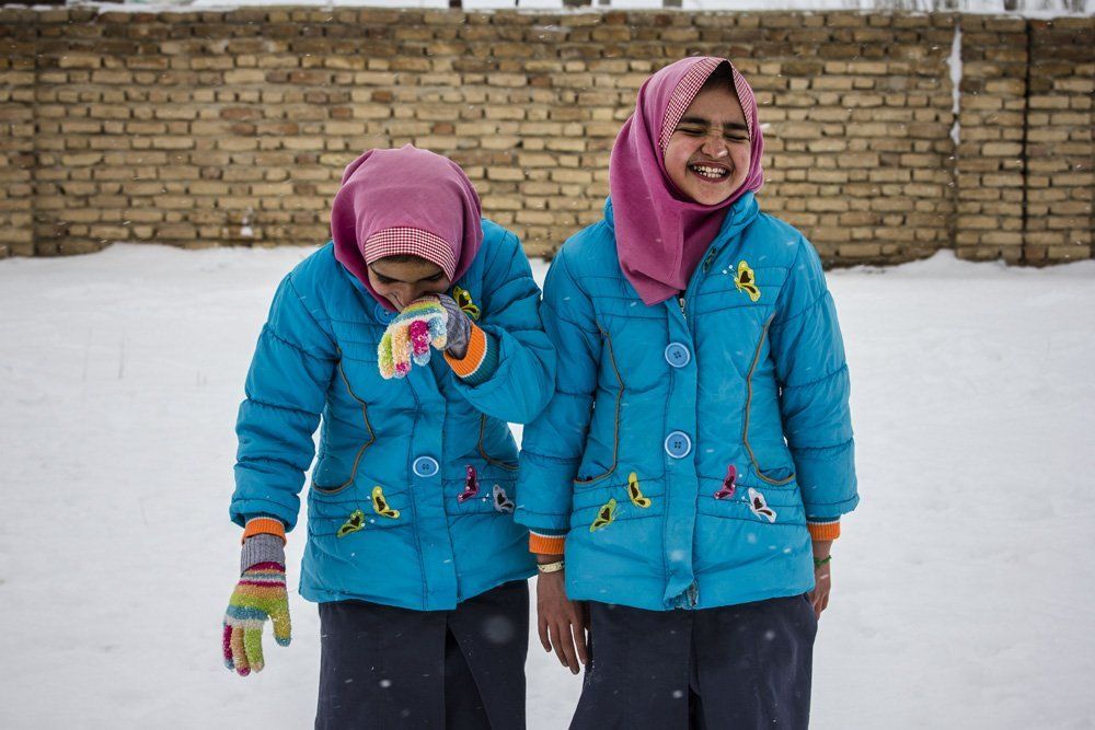 smiley twins in the snow