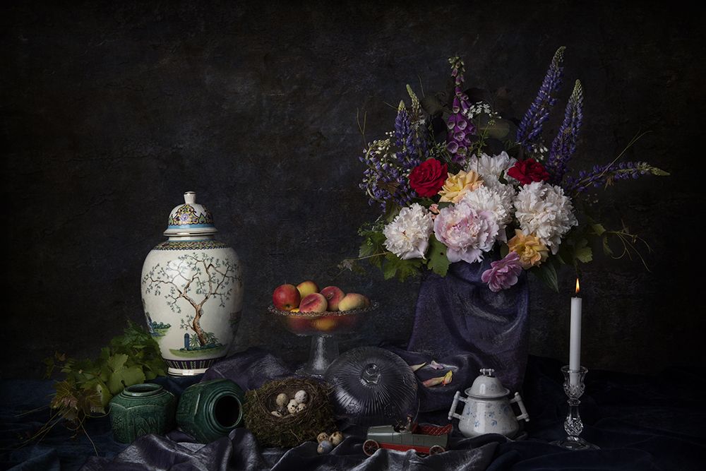 Flower still life with peonies and bird's nest