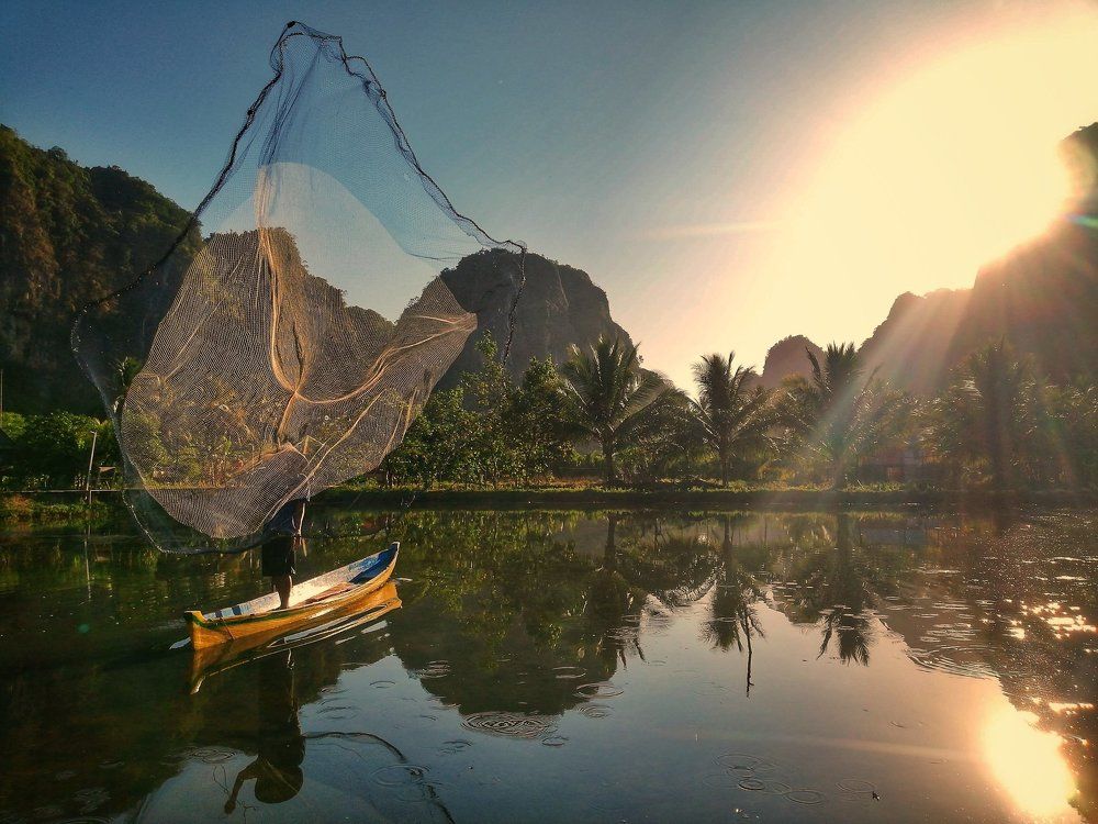 a fisherman is catching fish