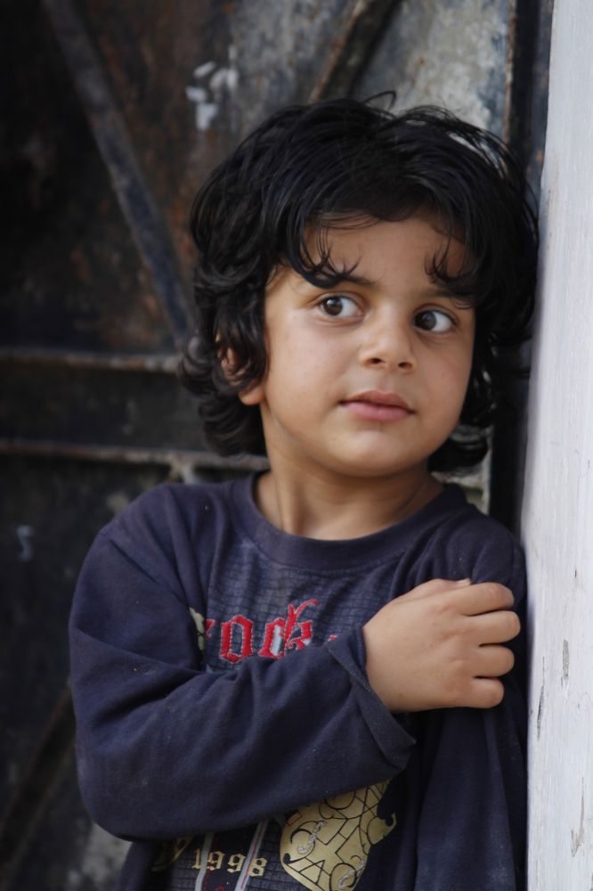 Kid giving pose for photograph