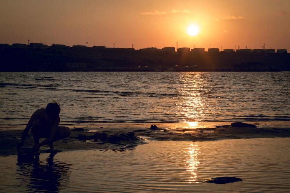 Child and sunset