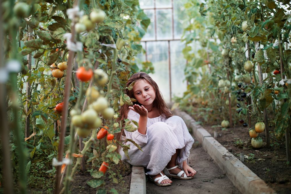 Girl in the greenhouse