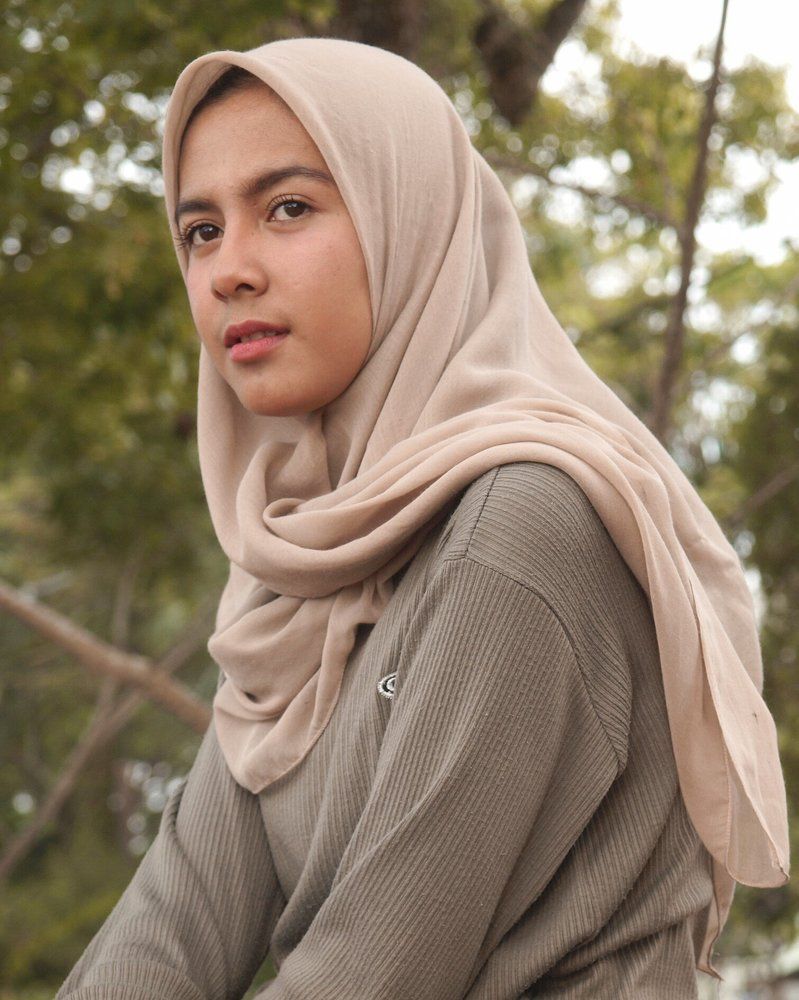 the smile of a woman hijabers