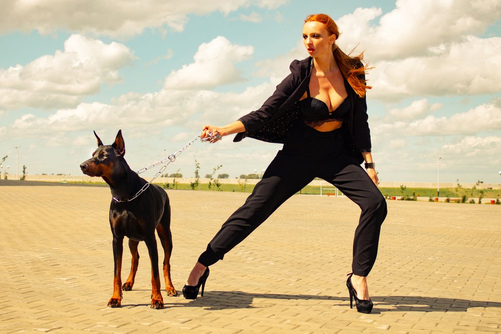 Girl and Doberman