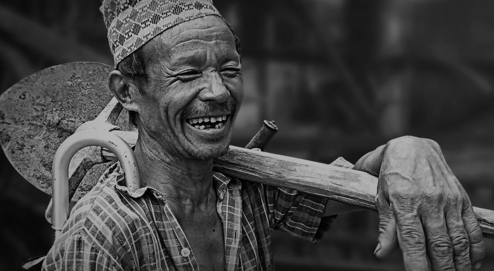 Smiling of a farmer while facing camera 1st time