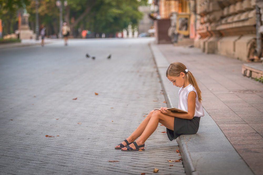 Schoolgirl Reading a Book