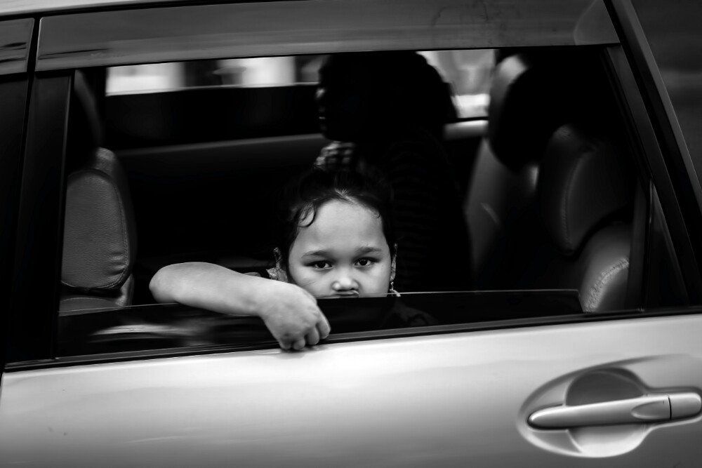 Little girl in the car window
