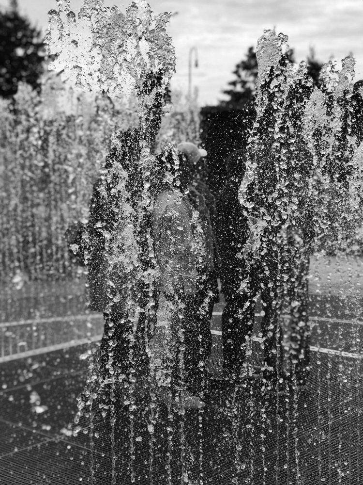 Who is behing the water?