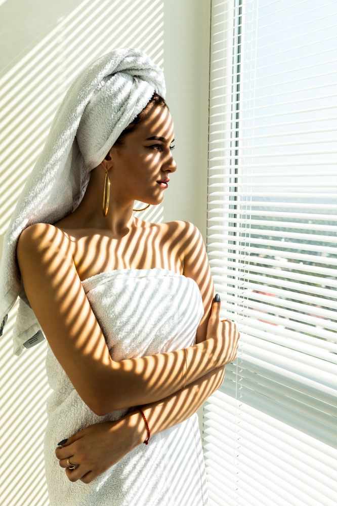 In the golden rays of the rising sun overlooking the grizzled Elbrus in cloud haze.