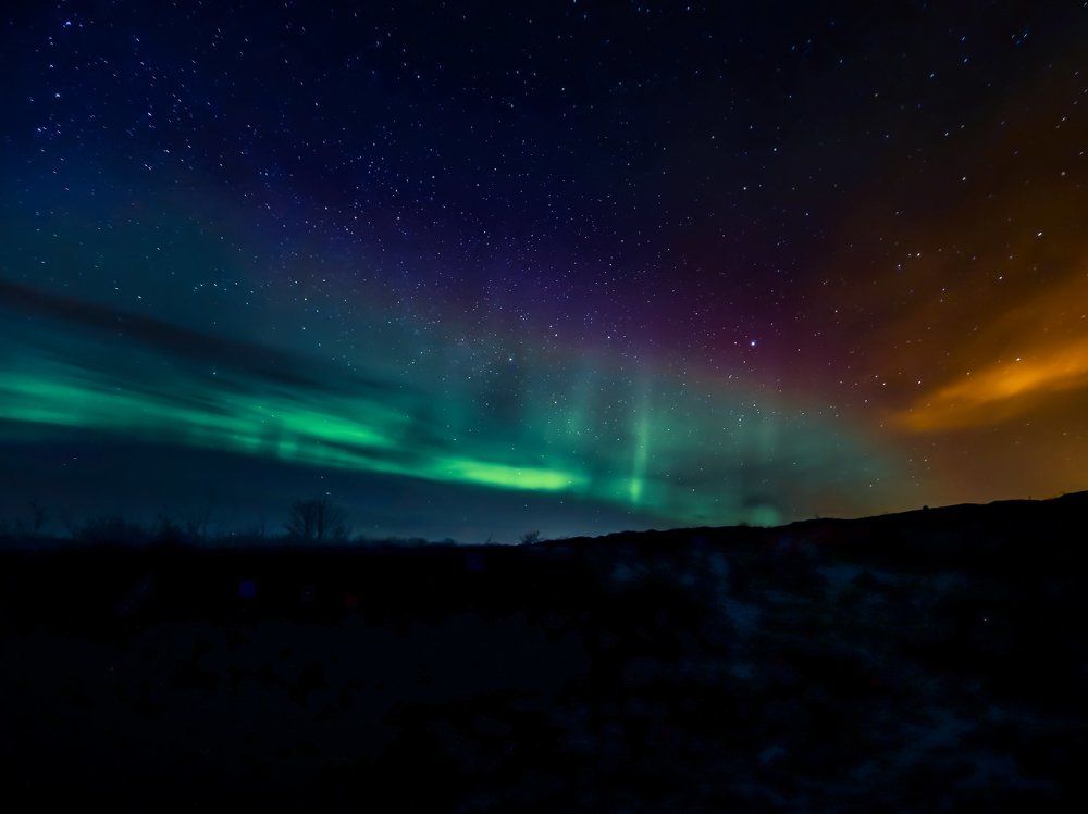 Nacreous Clouds and Aurora Borealis