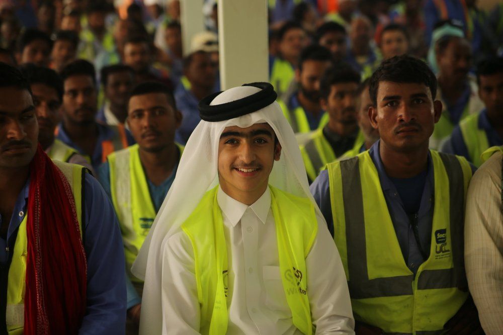 QATAR CHARITY TEAM WITH WORKERS