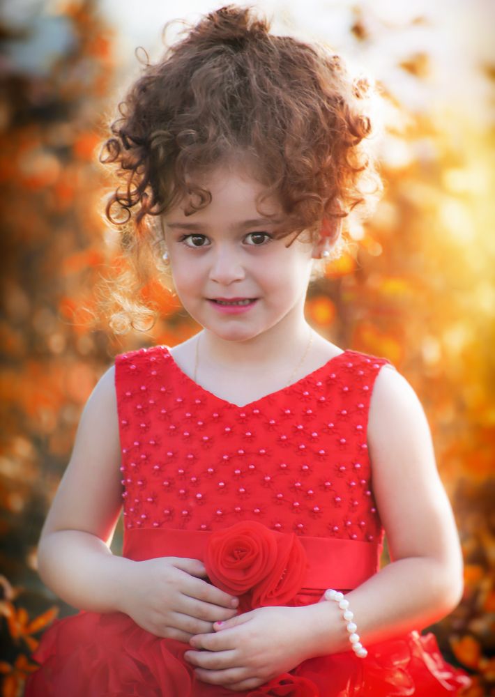 A girl smiling at sunrise