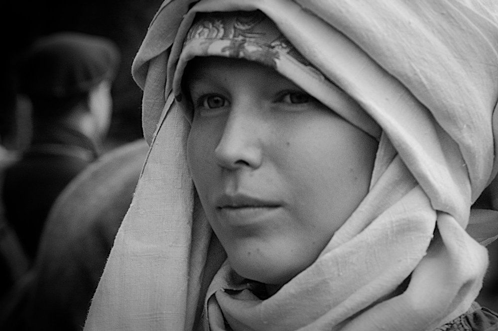 Young girl in a white scarf