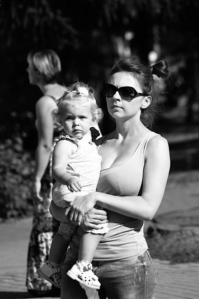 Portrait of mother and child walking in the park