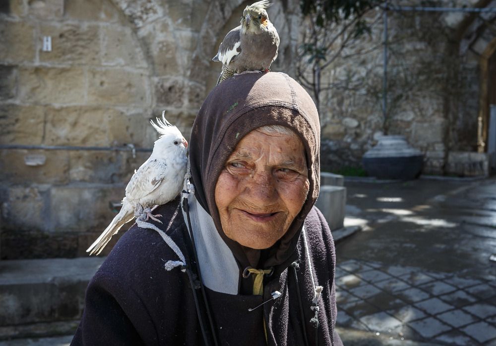 Old woman with birds