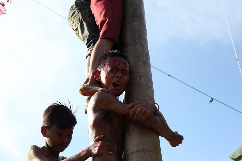 climbing slippery pole