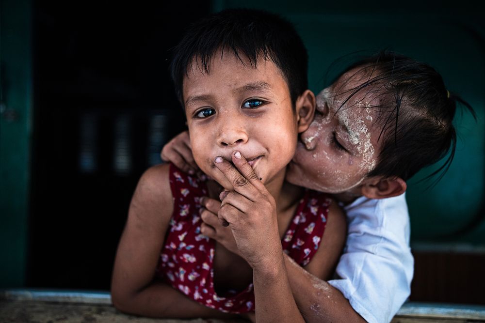 Two children, boy and girl in train.