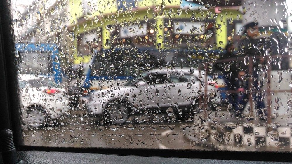 RAIN DROPS IN THE CAR WINDOW