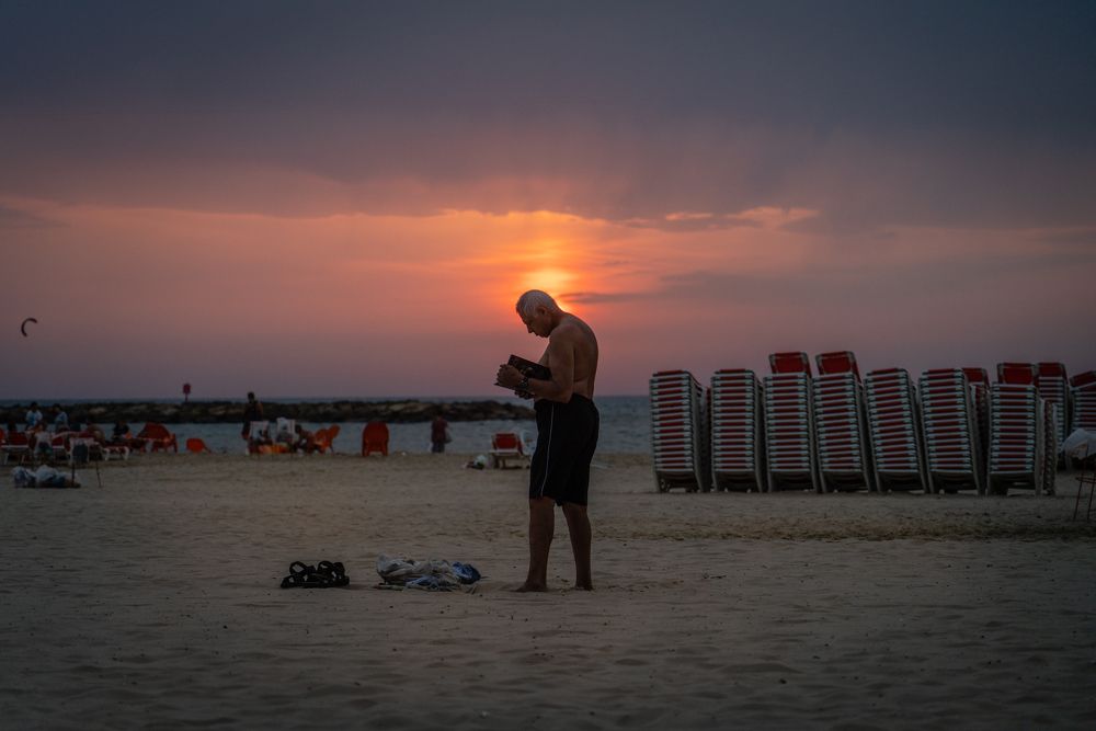Bookworm on the beach in Tel Aviv