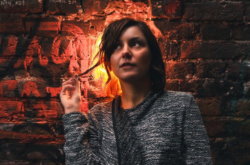 Girl at the brick wall