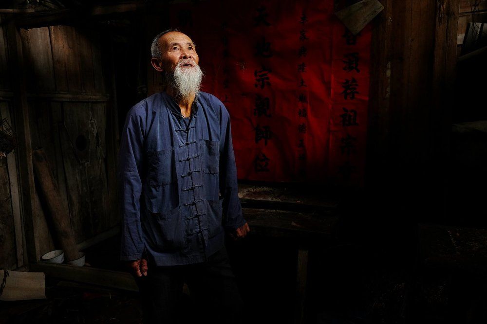 A fisherman at his home