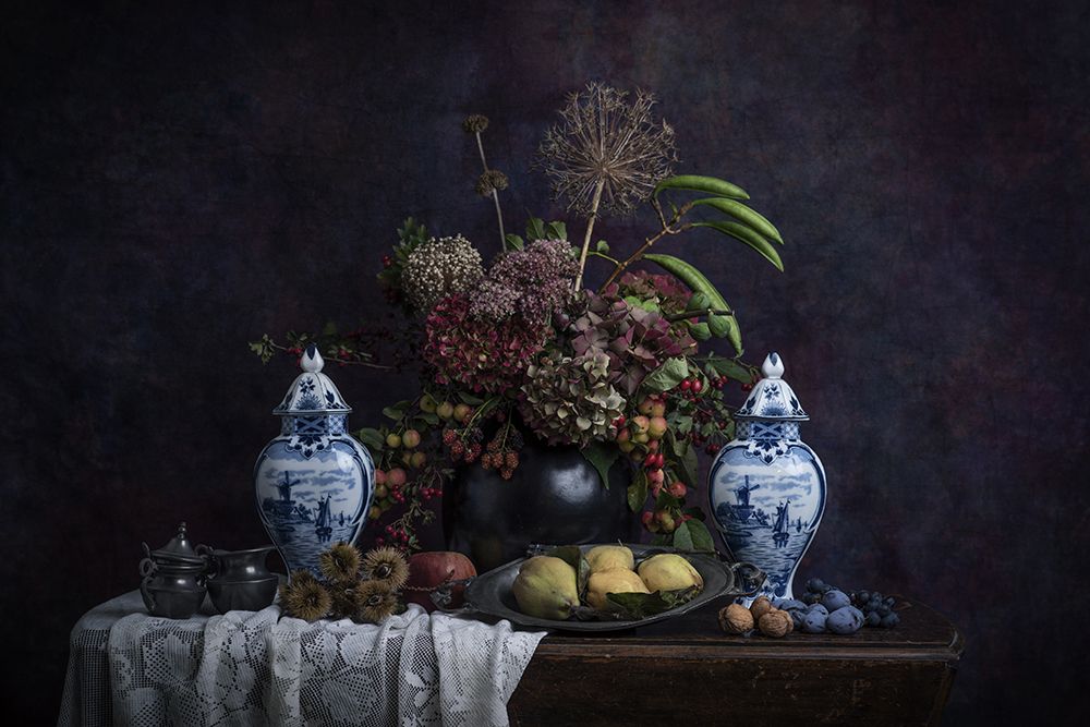 Flower still life with Delft blue and quinces